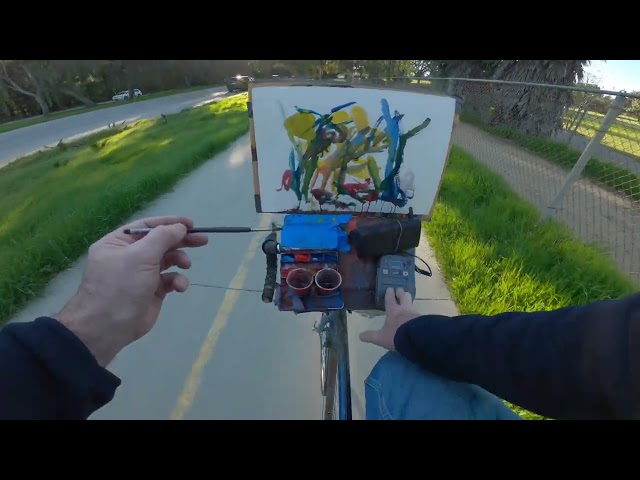 Bicycling while painting and playing music