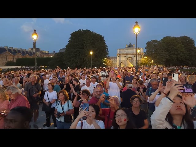 Crowds Watch Olympic Cauldron Balloon Rise Into Paris Sky
