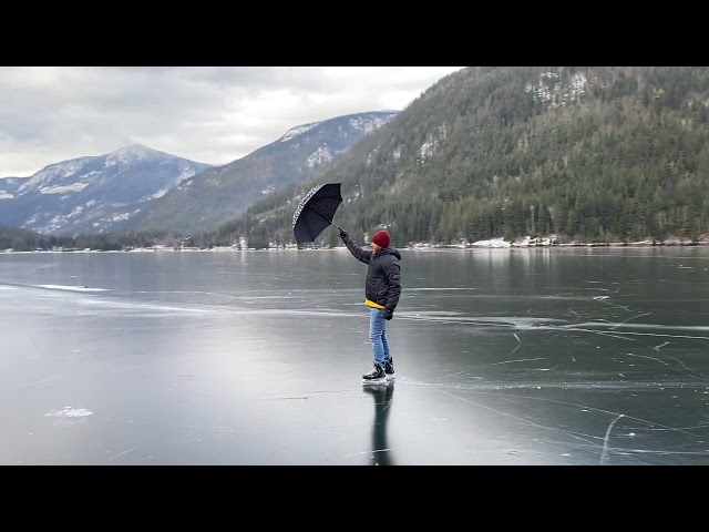 Canadian Man Travels Mary Poppins Style Across Frozen Lake With Umbrella Sail