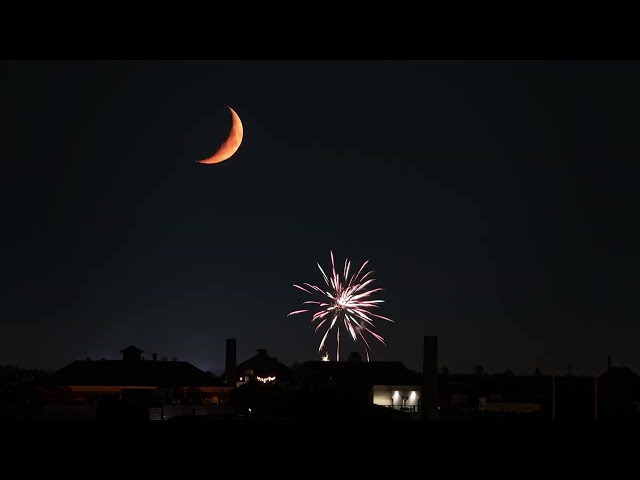 Timelapse Footage Shows Waxing Crescent Moon Setting Over Chicago as Fireworks Begin
