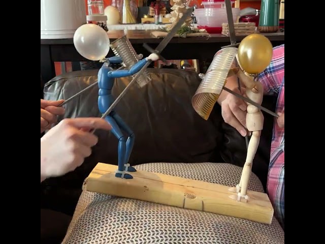 Man Creates Rock 'Em Sock 'Em Robots with Balloons for Heads