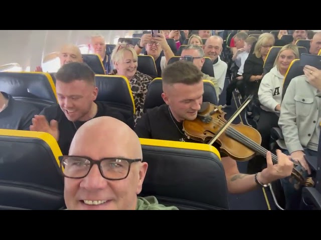 Musician Entertains Travelers on Flight