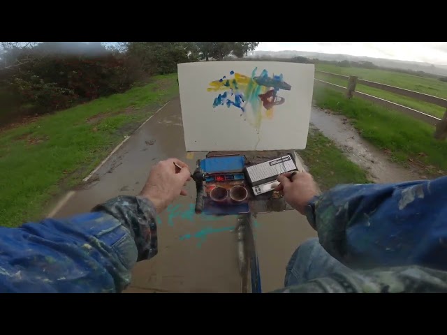 Bicycle painting and playing music in the rain
