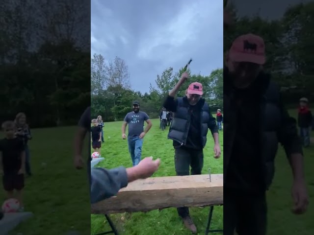 Workers Play a Thrilling Game With Hammer and Nail