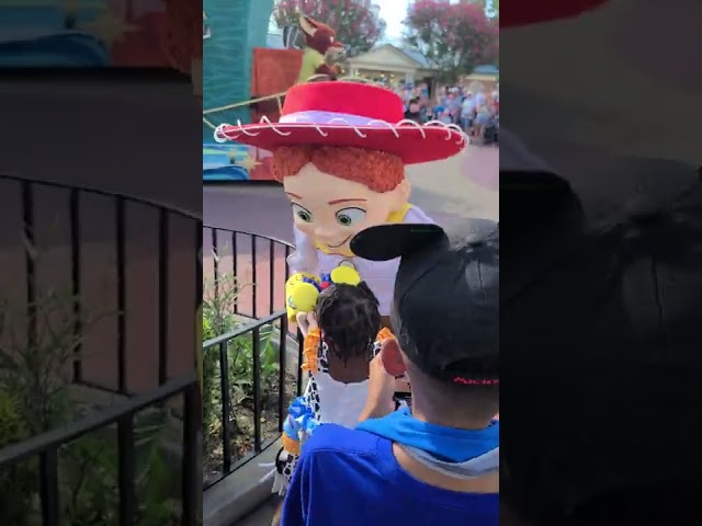 'Toy Story' Woody Greets Child at Walt Disney World Parade