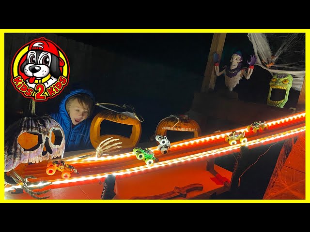 OUR FAMILY PLAYS 🎃 Monster Jam HALLOWEEN NIGHT RACE 🏴‍☠️ Downhill Racing into Grave Digger Pumpkin!