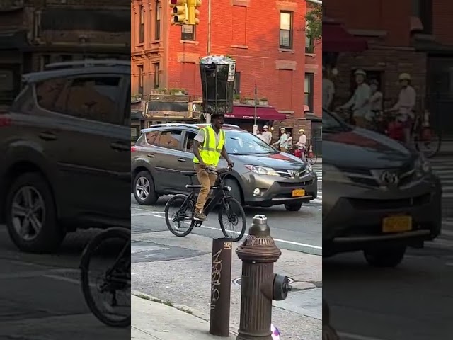 Man Balances Trashcan Atop Head While Cycling Through Brooklyn Streets